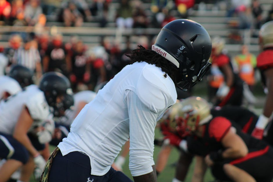 Focused shot of football players in action on a field during a game.