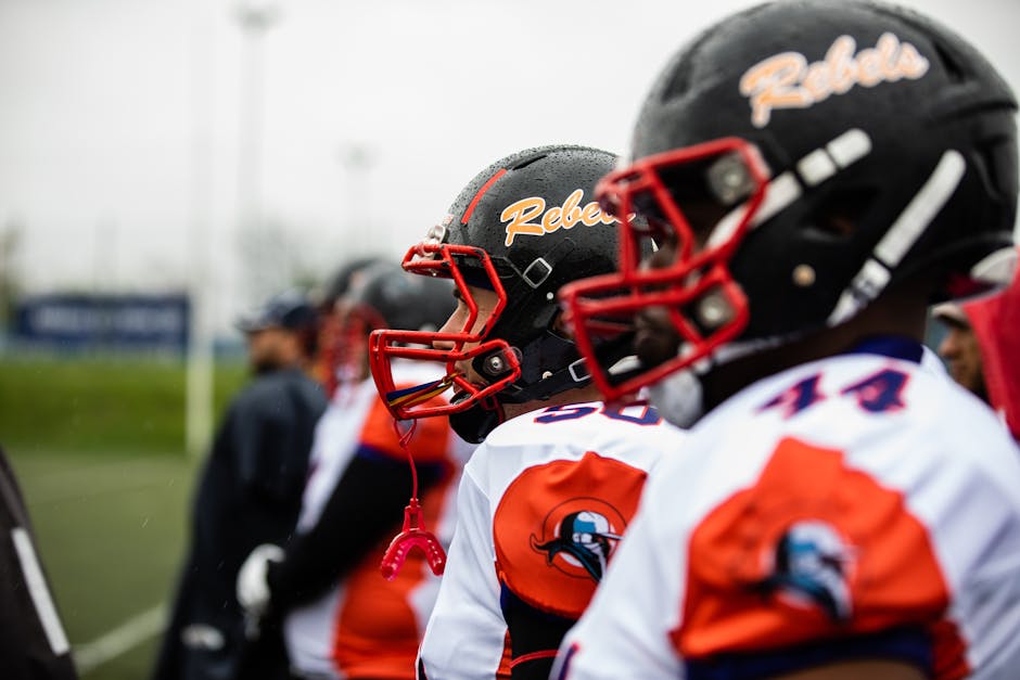 Intense focus of American football players ready for action on field in Bucharest.