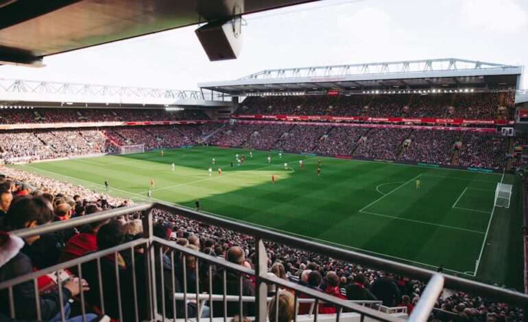 A vibrant soccer game with a full crowd in a modern stadium, capturing the energy of the sport.