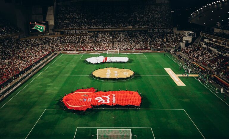 Aerial shot of a football match in Abu Dhabi stadium filled with enthusiastic fans.