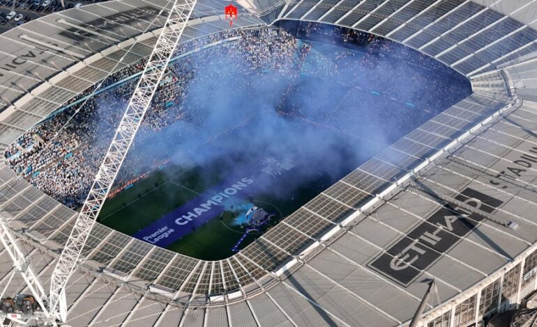 Aerial shot of Etihad Stadium during a soccer event in Manchester, UK.