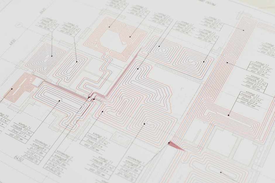 Close-up view of a detailed architectural blueprint with intricate designs and data points.