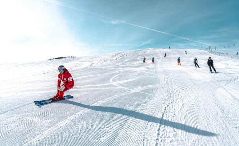 Skiers enjoy a bright winter day on the snowy slopes of Lombardia, Italy.
