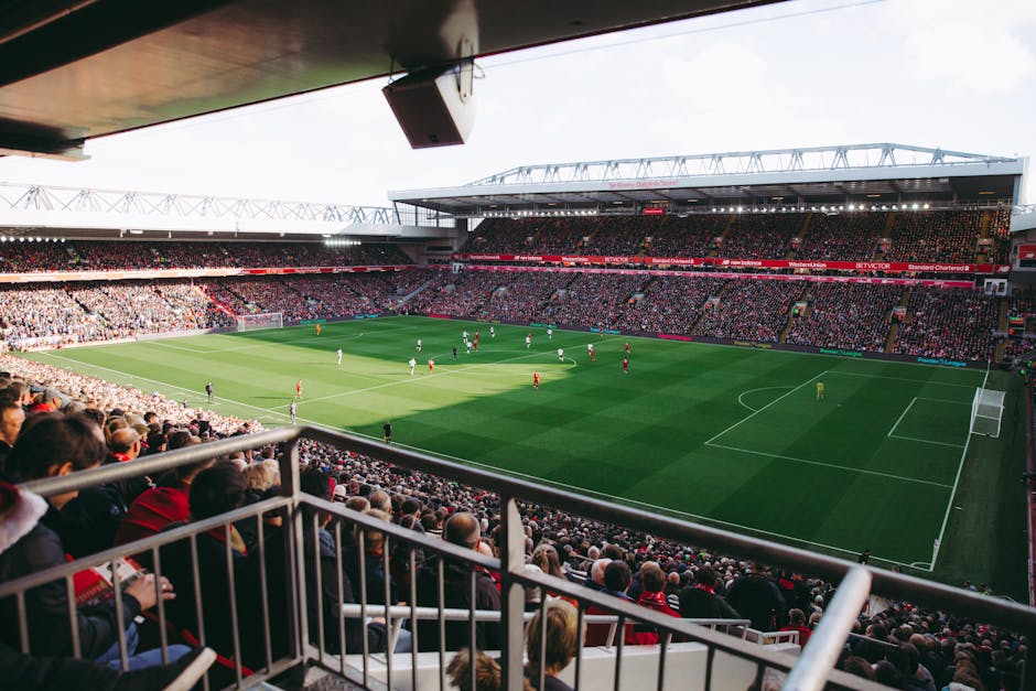 A vibrant soccer game with a full crowd in a modern stadium, capturing the energy of the sport.