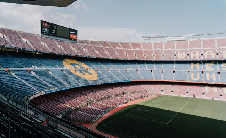 View of Camp Nou stadium in Barcelona, showcasing the iconic stands and field.