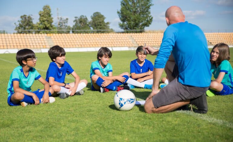 Children gather for a soccer coaching session on a sunny day in Portugal.
