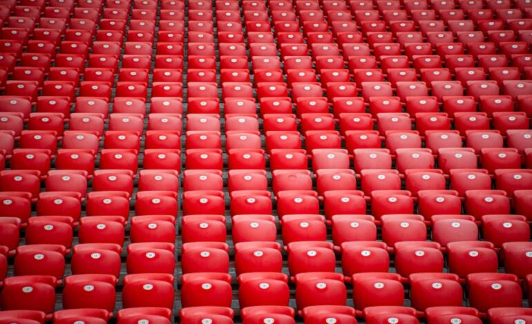 A striking repetition of red stadium seats at San Mames Stadium, Bilbao, Spain.
