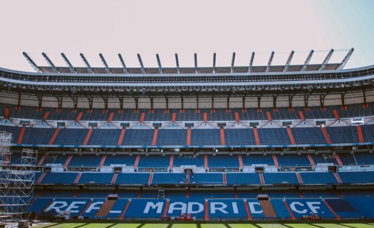 Empty stands of Santiago Bernabéu Stadium in Madrid, showcasing Real Madrid CF's seats.