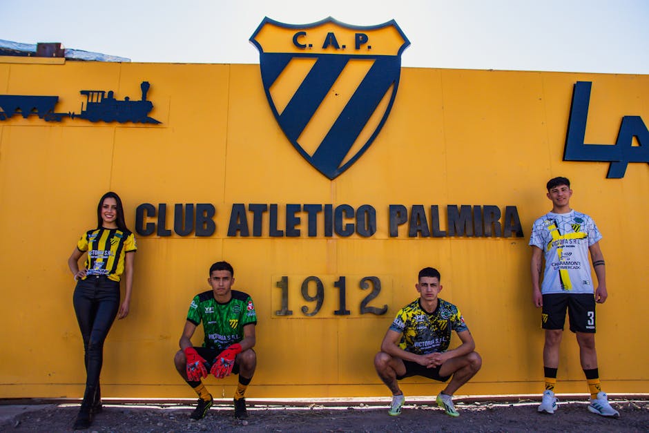Members of Club Atletico Palmira posing proudly in team apparel.
