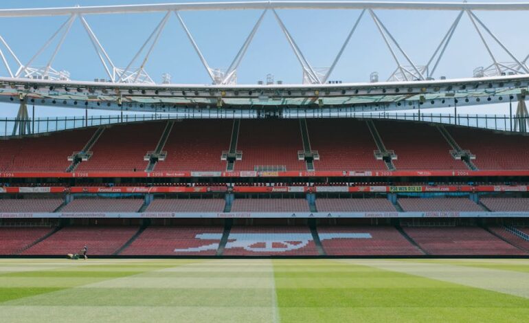 A view of the empty stands and football pitch at Emirates Stadium, London, England.