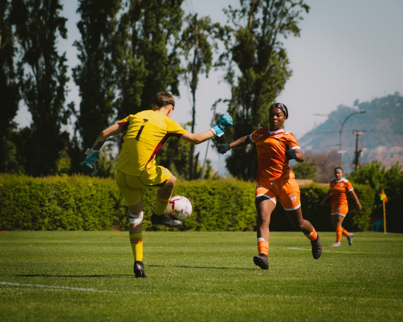 Action-packed soccer match in Chile with players in motion on a sunny outdoor field.
