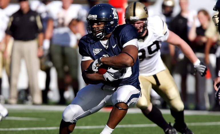 Intense moment captured during an American football game showcasing players in full action on the field.