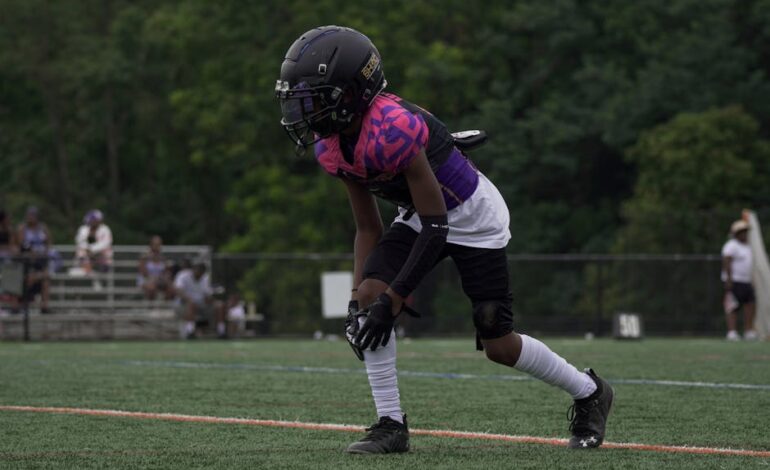 Youth football player in action on the field in Columbia, MD.