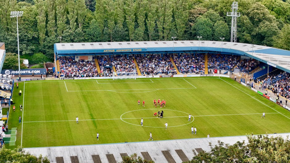 An aerial view of a football match in progress at Bury's Arthur Ashworth Stand.