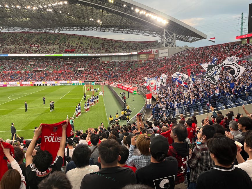 A thrilling soccer match at a packed stadium with energetic fans waving flags and cheering in Japan.