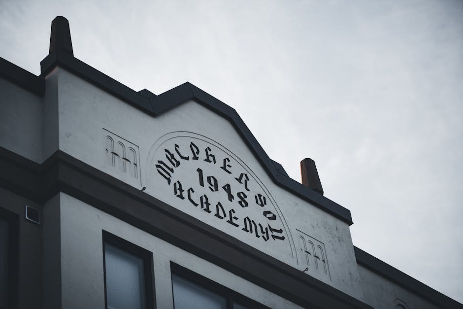 A vintage building facade featuring retro signage in artistic script from 1948.