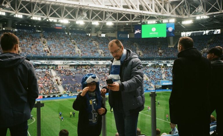 Crowd enjoying a football match in Saint Petersburg stadium, Russia.