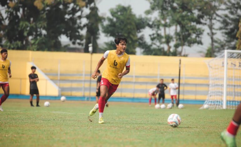 Energetic soccer players during practice session at Jakarta field.