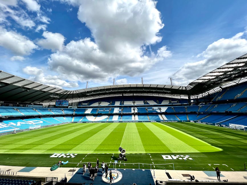 A view of the iconic Etihad Stadium in Manchester, United Kingdom, showcasing its vibrant football field.