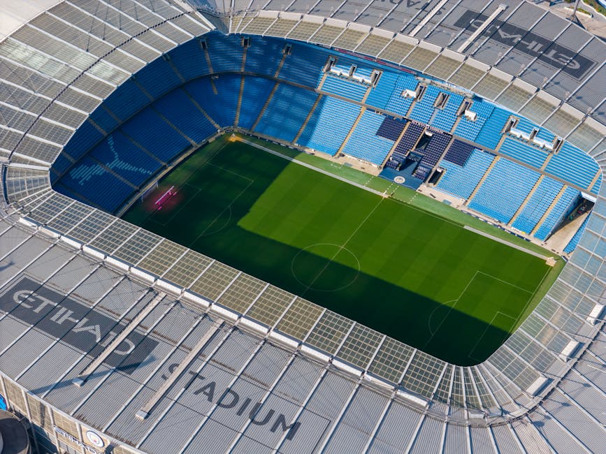 Stunning aerial shot capturing the modern architecture of Etihad Stadium in Manchester.