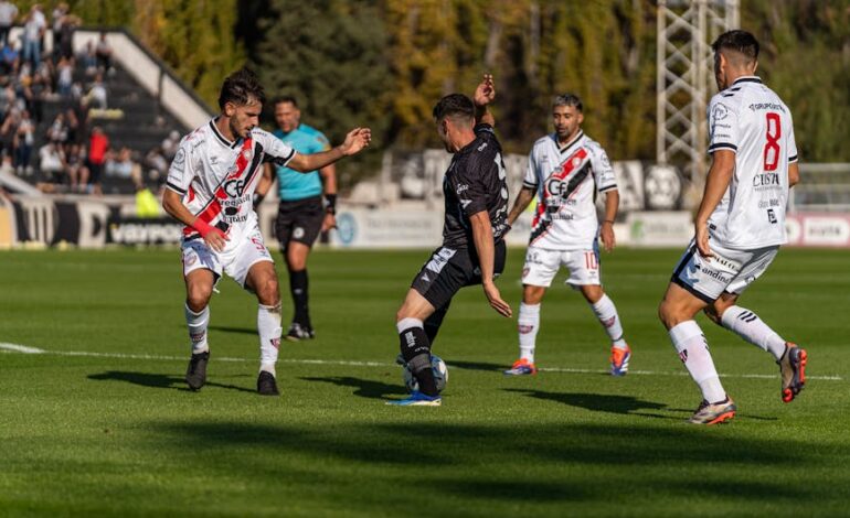 Intense soccer match showcasing skill and teamwork on a sunny outdoor field.