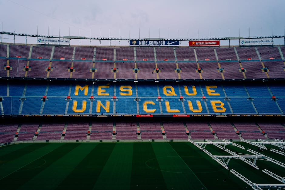 View of Camp Nou stadium seating displaying 'Mes Que Un Club' in Barcelona, Spain.