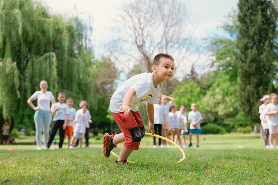 Kids enjoy outdoor fun with hula hoops in a vibrant park setting.