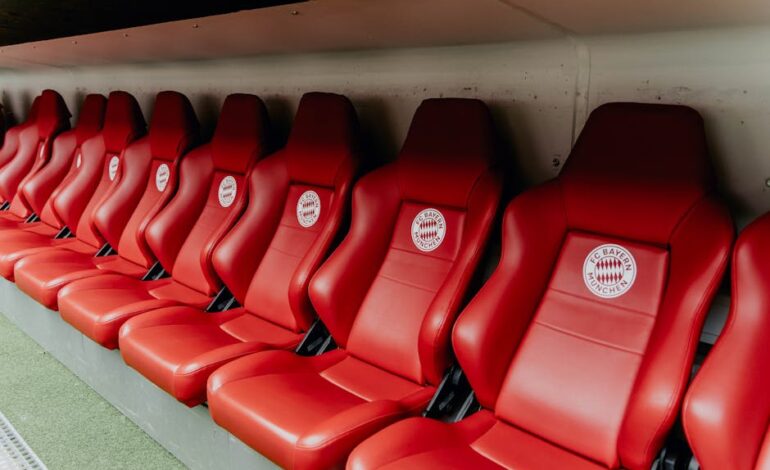 Red seats at Bayern Munich's Allianz Arena, showcasing iconic stadium design.