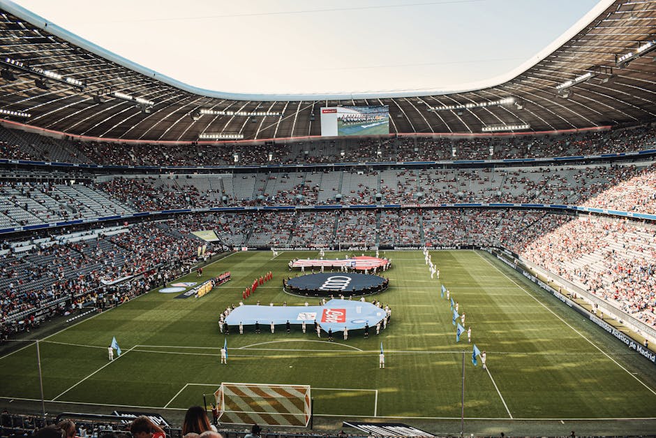Captivating view of a soccer match at Munich's iconic Allianz Arena, filled with excited fans.