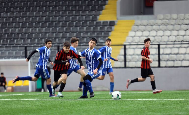 Young soccer players in action on a field. Ideal for sports and teamwork concepts.