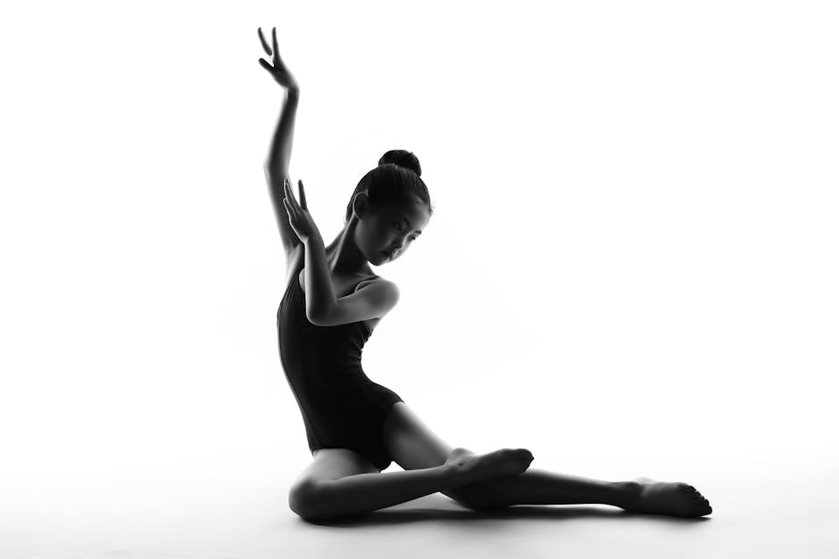 Silhouette of a graceful young dancer in an artistic ballet pose, showcasing elegance and skill.