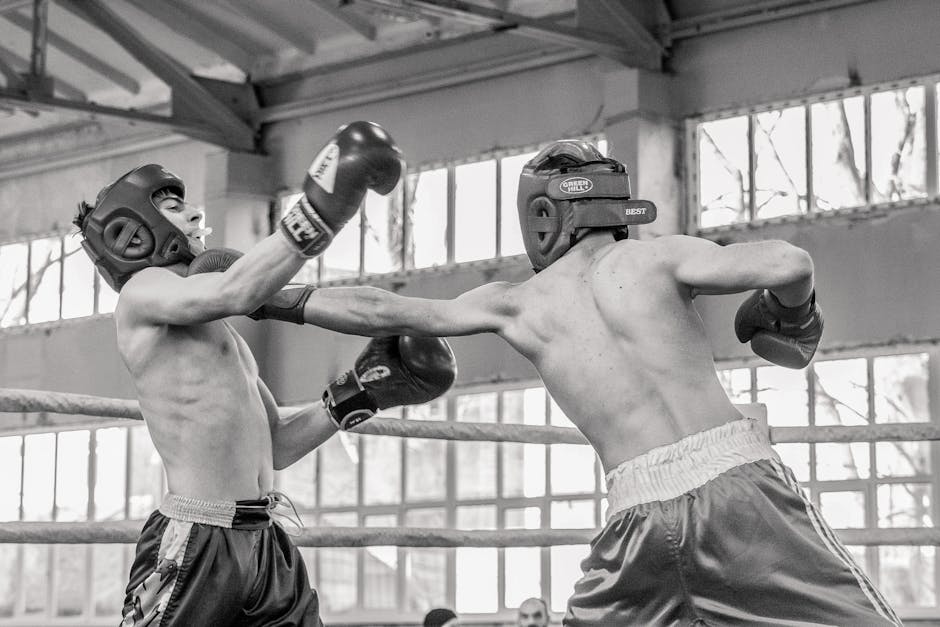 Intense training boxing match focused on agility and strength indoors.