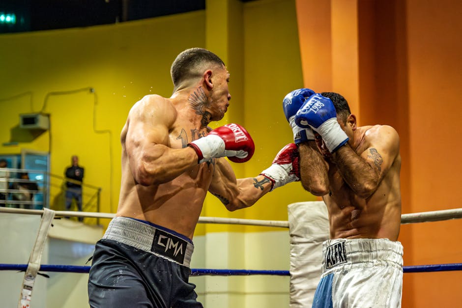 Two boxers in a high-energy match inside an arena showcasing intense combat and skill.