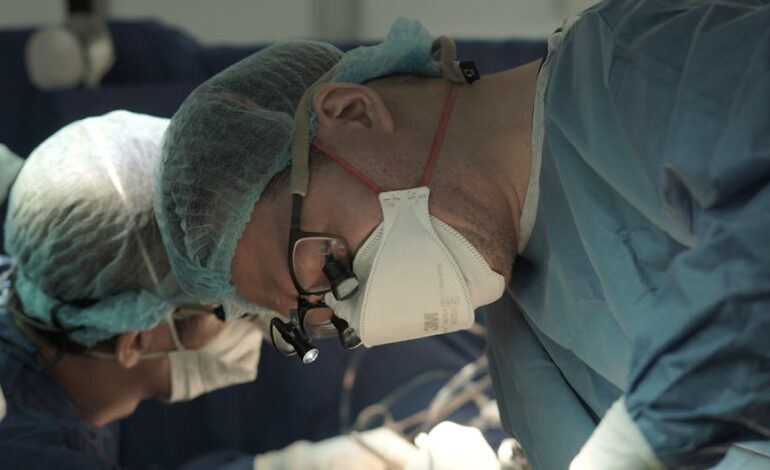 Surgeons in an operating room performing a delicate procedure with precision and teamwork.