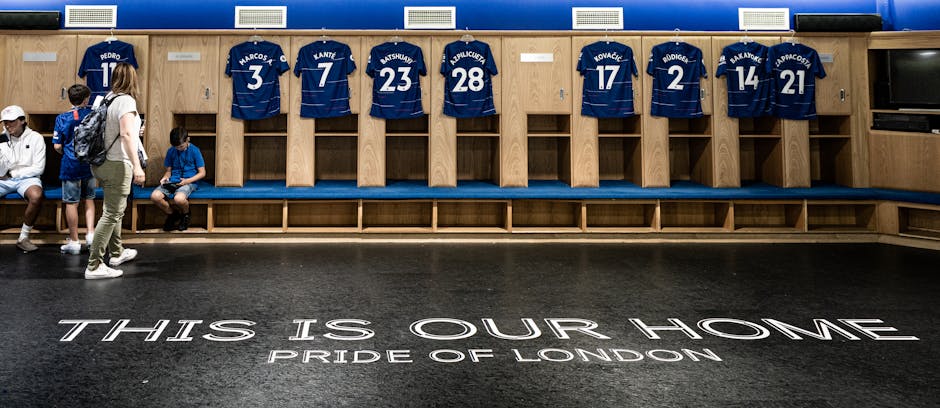 Locker room at Stamford Bridge featuring Chelsea FC jerseys and the Pride of London motto.