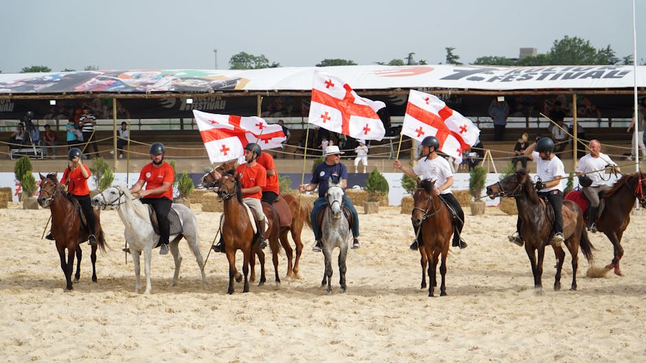 Riders with Georgian flags at an equestrian event in İstanbul, Türkiye.