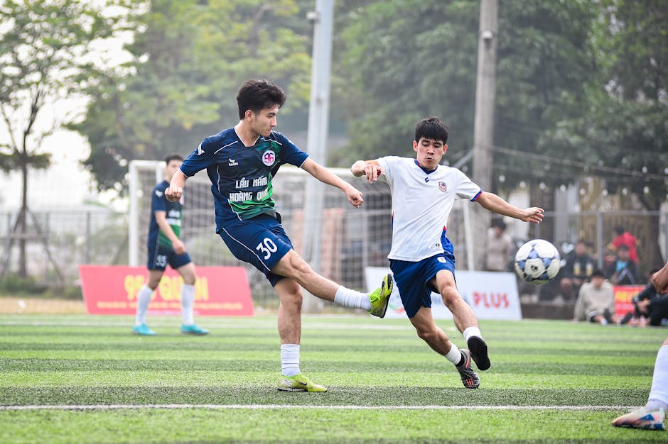 Dynamic soccer match between local teams in Hà Nội, showcasing athletic skills.