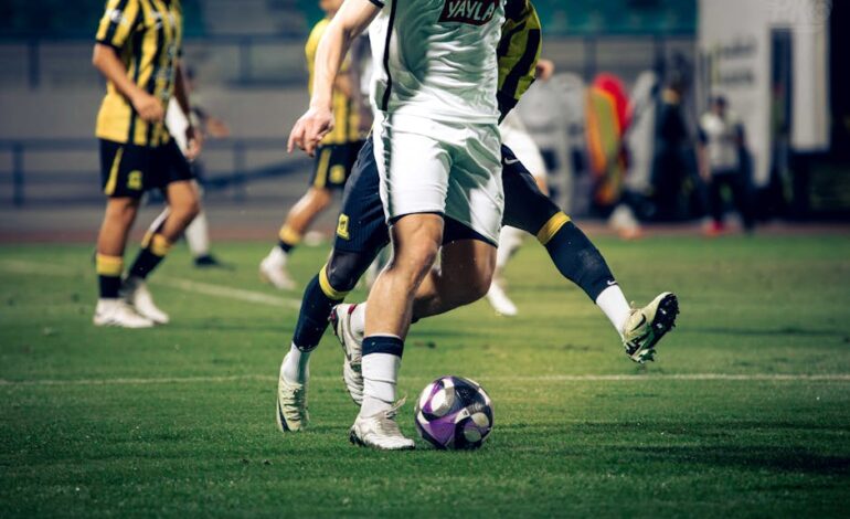 Close-up of soccer players in action during a match at an outdoor stadium.
