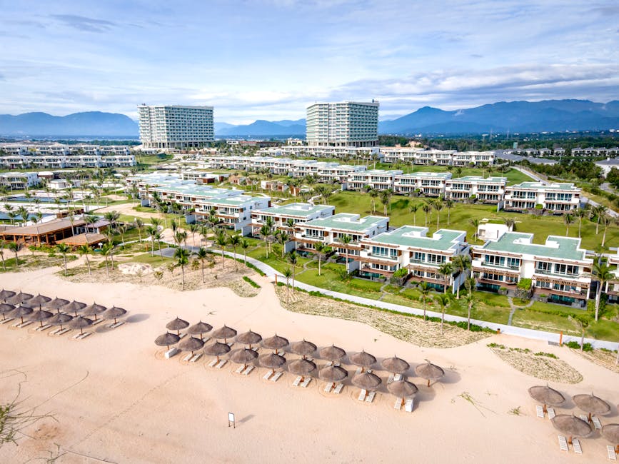 Aerial view of luxury beachside villas and resort in Vietnam, perfect for a tropical getaway.