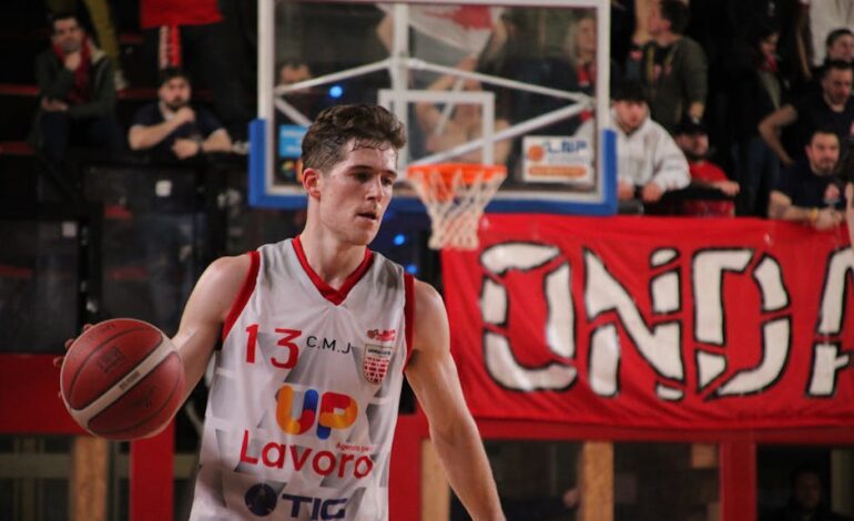 Action-packed basketball game captured in Imola, showcasing a focused player mid-game.