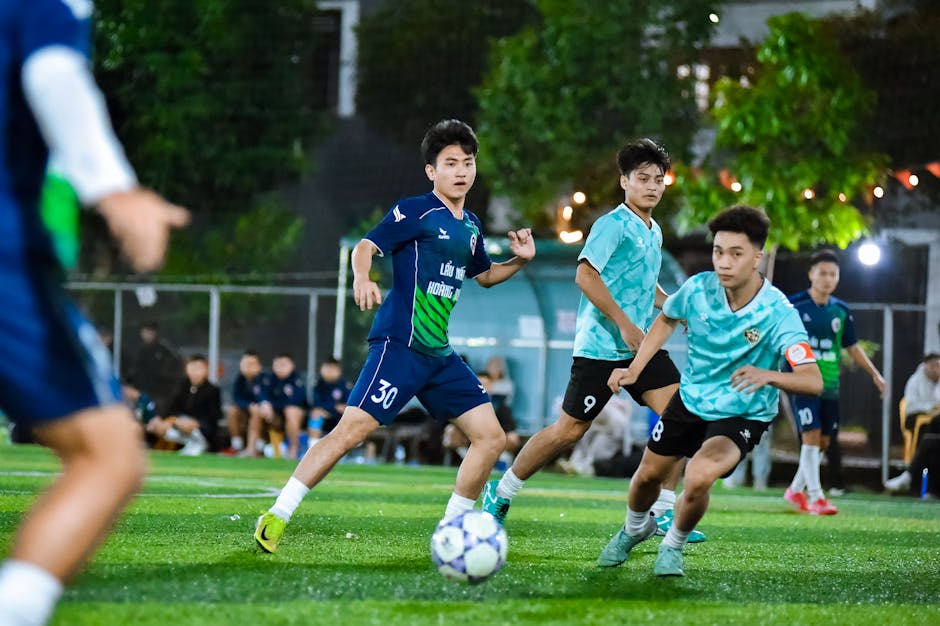 Exciting football match captured in Hà Nội, showcasing teamwork and sportsmanship.