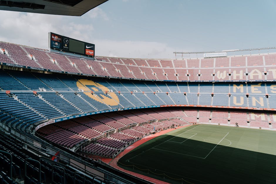 View of Camp Nou stadium in Barcelona, showcasing the iconic stands and field.