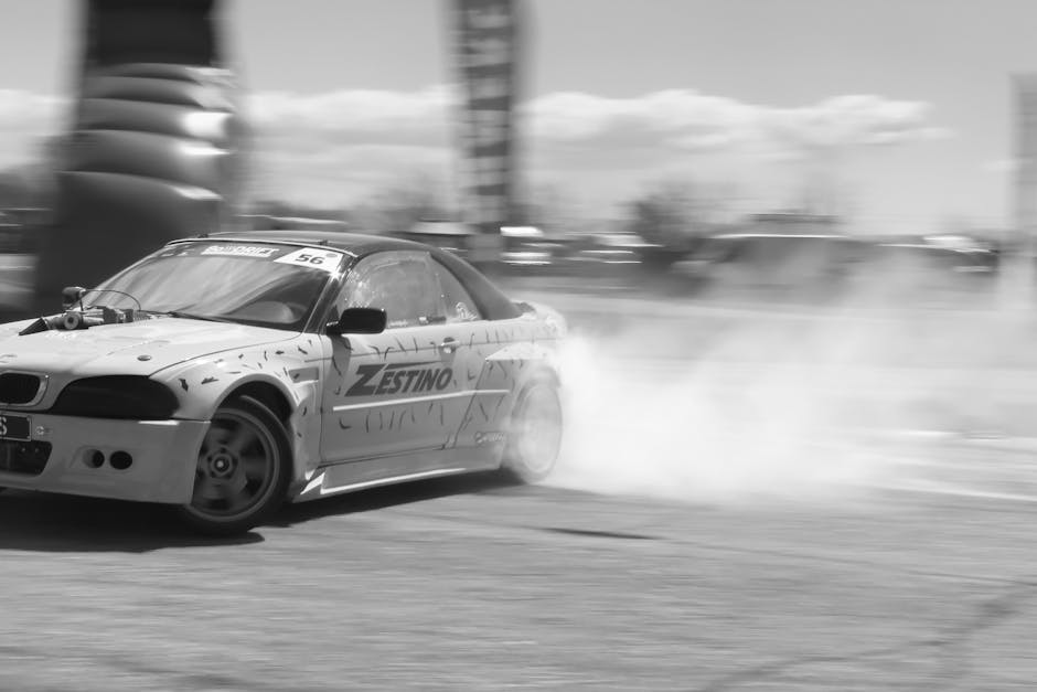 A black and white image capturing a thrilling moment in a drift racing competition in Plovdiv, Bulgaria.