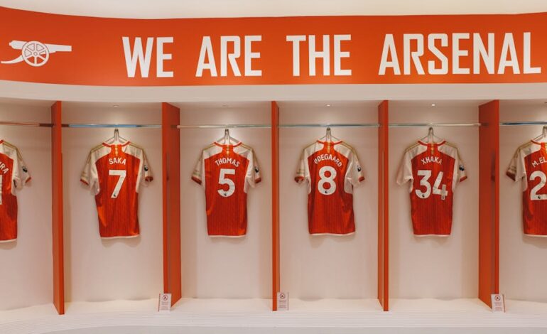Arsenal FC jerseys on display in the Emirates Stadium locker room, London.