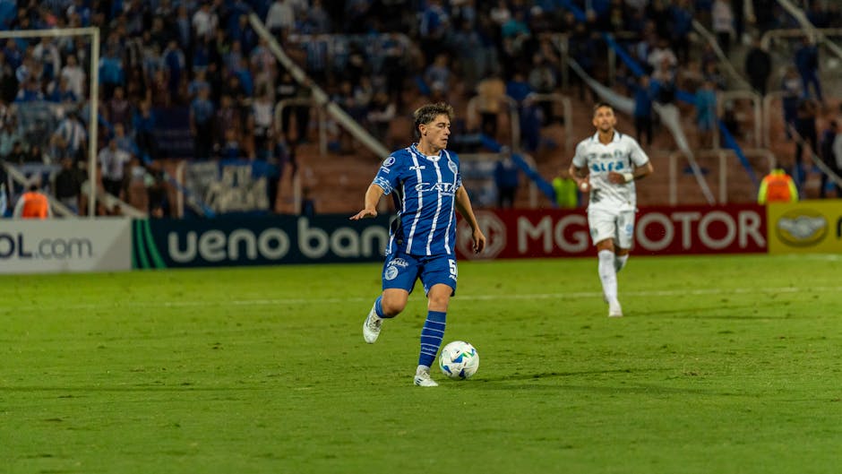 Football match scene with a player in action, showcasing dynamic sportsmanship.