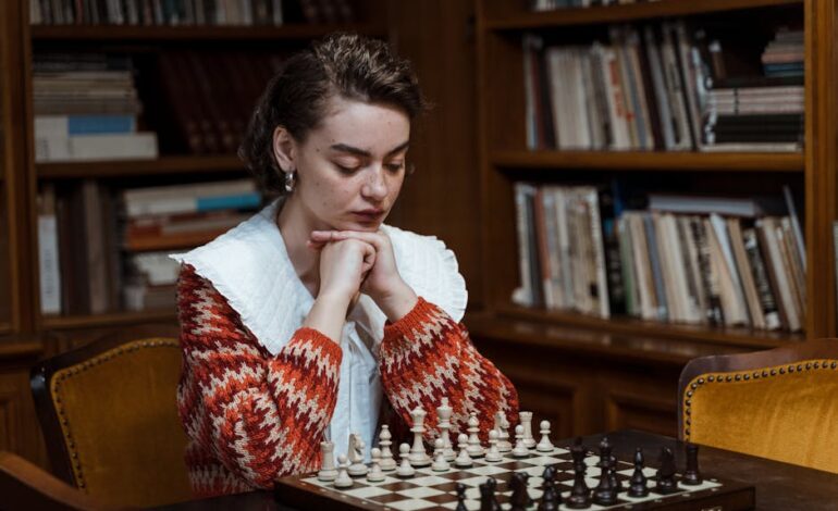 A woman in a library focused on a chess game, embodying strategy and thoughtfulness.
