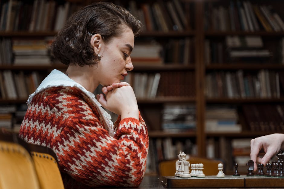 Woman focused on chess strategy in a warm, cozy library ambiance.