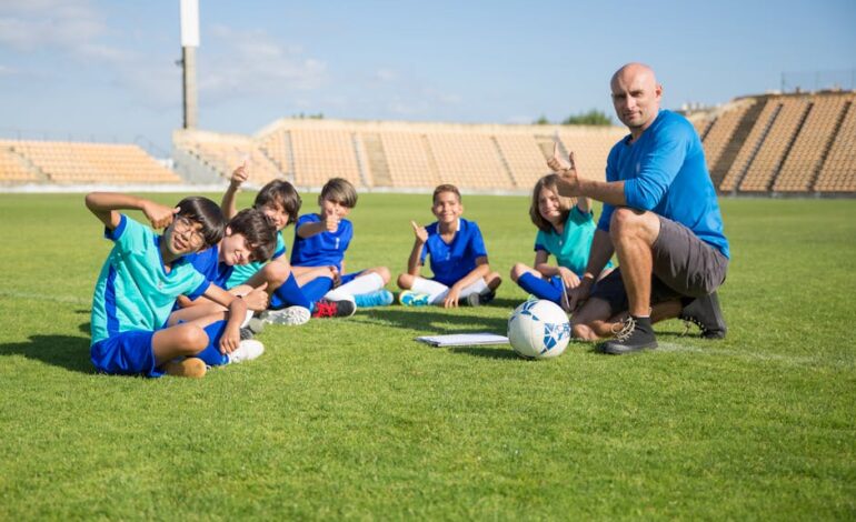 Children enjoying soccer training with coach at an outdoor stadium. Smiles and teamwork on a sunny day.