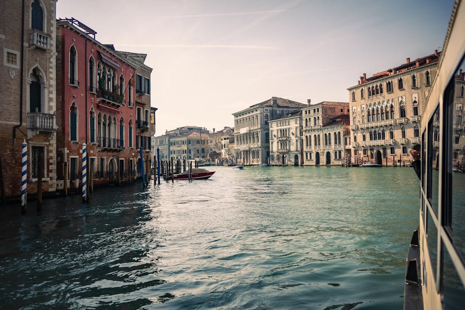 A picturesque view of Venice's Grand Canal with historic architecture and boats.