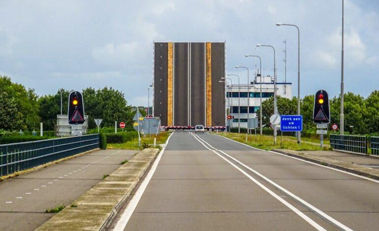 Bascule bridge opens for marine traffic on a highway in Lelystad, Netherlands.